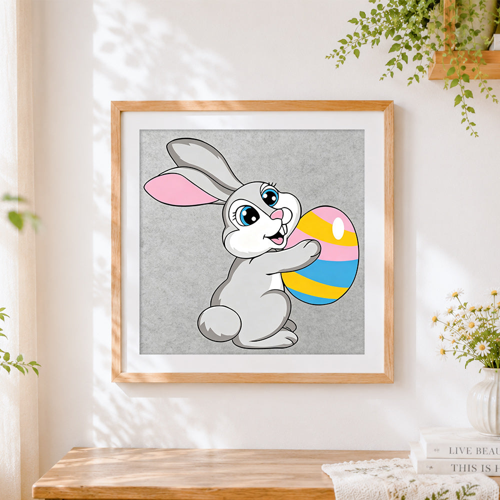 Finished easter bunny with colourful egg cross stitch artwork displayed