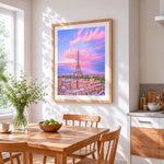 Eiffel tower and pink sunset cross stitch artwork displayed on wall as home decor