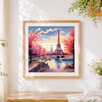 Finished eiffel tower at sunset in autumn cross stitch artwork displayed