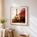 Eiffel tower at sunset with autumn leaves cross stitch artwork displayed on wall as home decor