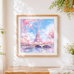 Finished eiffel tower in cherry blossom cross stitch artwork displayed