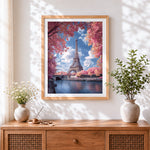 Finished eiffel tower in pink blossom cross stitch artwork displayed