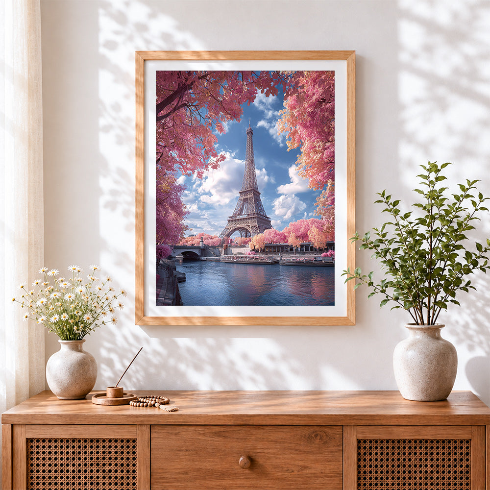 Finished eiffel tower in pink blossom cross stitch artwork displayed