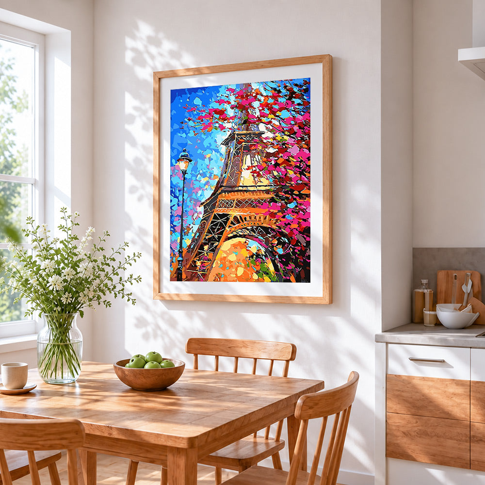 Eiffel tower through colourful leaves cross stitch artwork displayed on wall as home decor