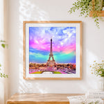 Finished eiffel tower under a colourful rainbow sky cross stitch artwork displayed