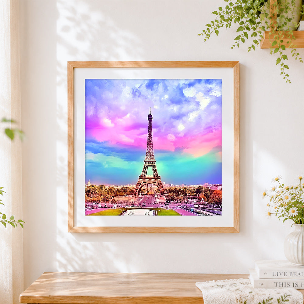 Finished eiffel tower under a colourful rainbow sky cross stitch artwork displayed