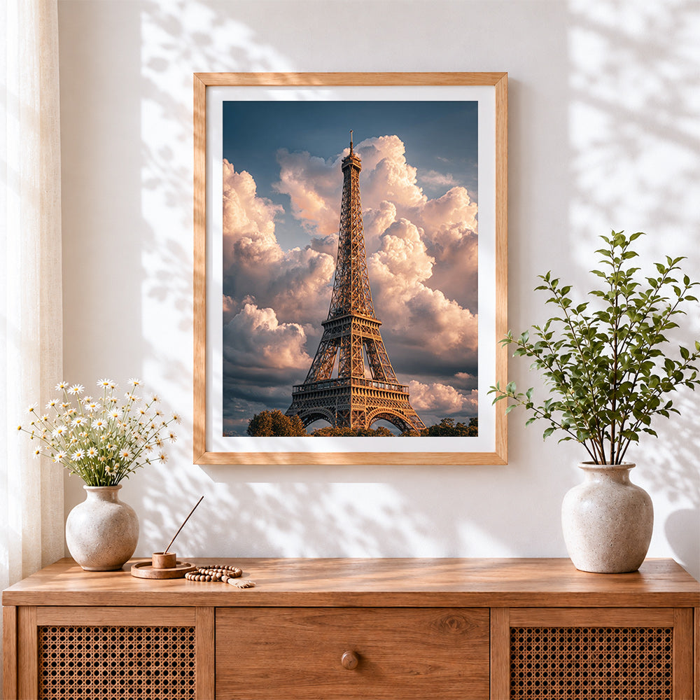 Finished eiffel tower under dramatic clouds cross stitch artwork displayed