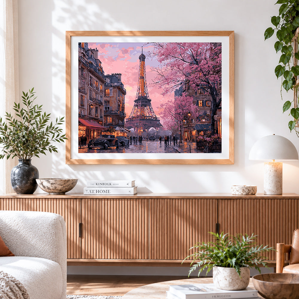 Finished eiffel tower with cherry blossoms cross stitch artwork displayed