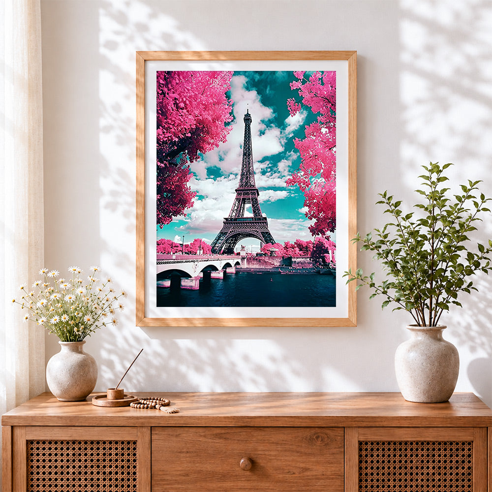 Finished eiffel tower with pink blossoms paint by numbers artwork displayed as home decor