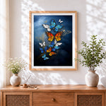 Finished elegant blue and orange butterflies cross stitch artwork displayed