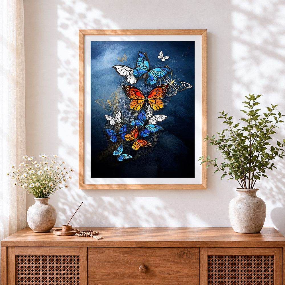 Finished elegant blue and orange butterflies cross stitch artwork displayed