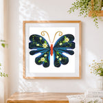 Finished elegant butterfly with daisies cross stitch artwork displayed