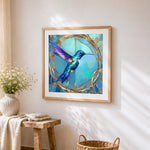 Elegant hummingbird in a gold frame cross stitch artwork displayed on wall as home decor