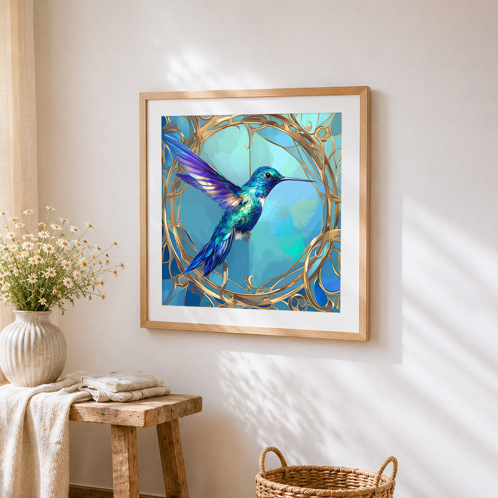 Elegant hummingbird in a gold frame cross stitch artwork displayed on wall as home decor