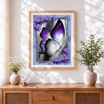 Finished elegant purple and white butterfly cross stitch artwork displayed