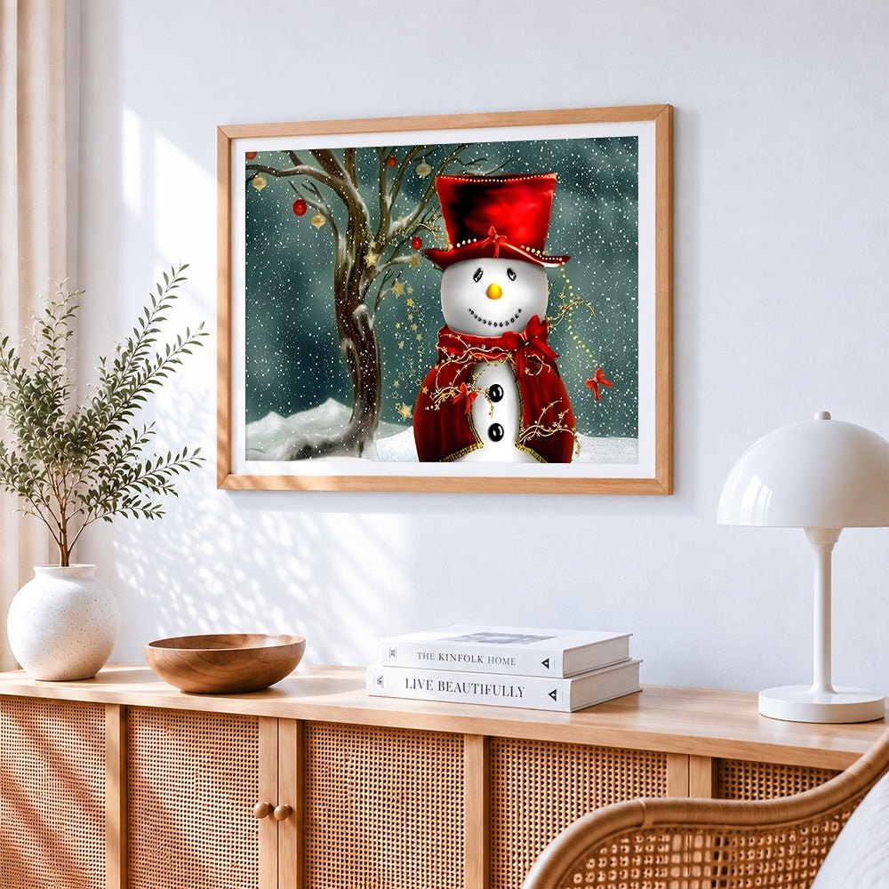 Elegant snowman with red hat cross stitch artwork displayed on wall as home decor