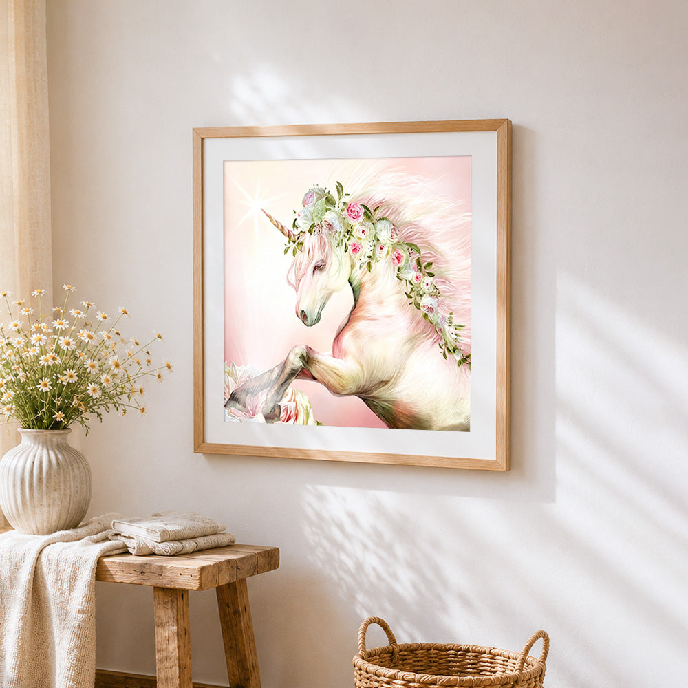 Elegant unicorn with floral crown cross stitch artwork displayed on wall as home decor