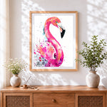 Finished elegant watercolour flamingo cross stitch artwork displayed