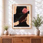 Finished elegant woman in black hat with rose cross stitch artwork displayed