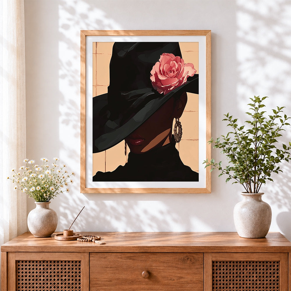 Finished elegant woman in black hat with rose cross stitch artwork displayed