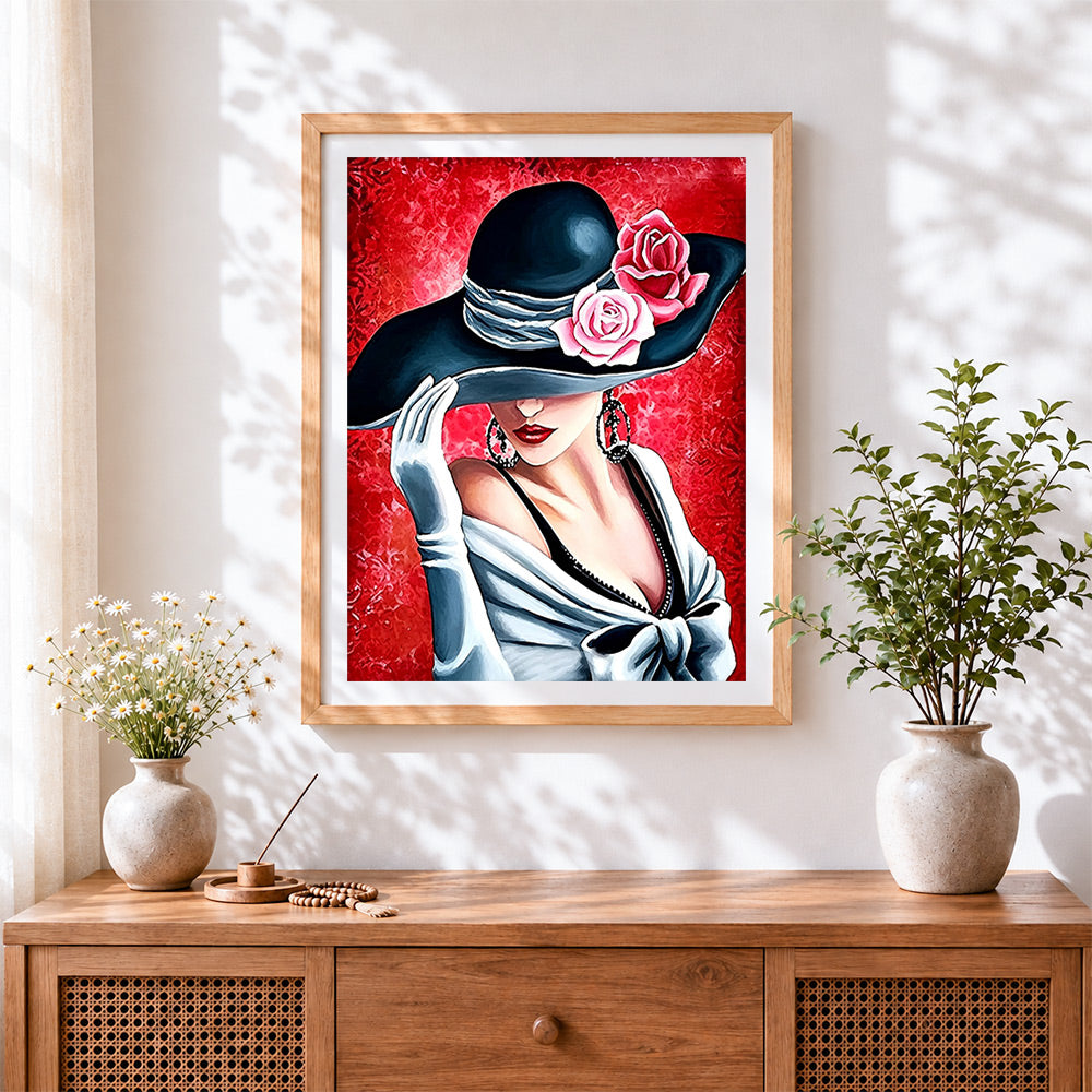 Finished elegant woman in black hat with roses cross stitch artwork displayed