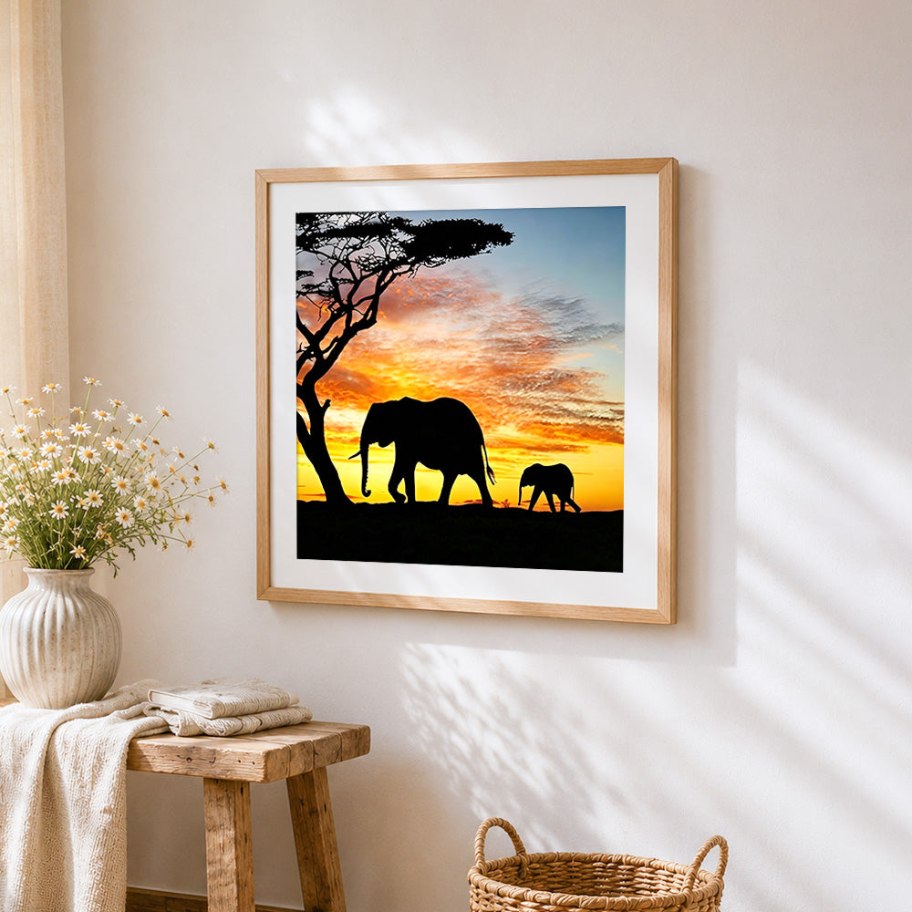 Elephant silhouette with acacia tree cross stitch artwork displayed on wall as home decor