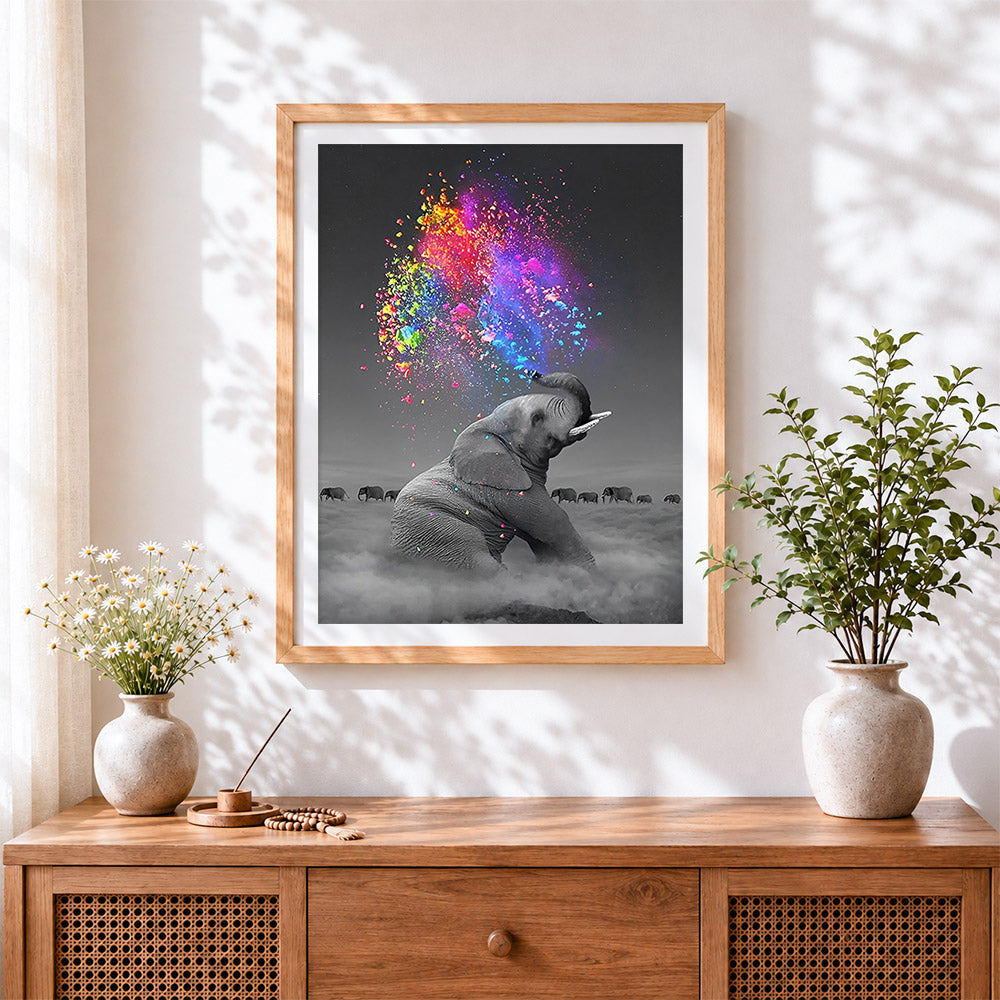 Finished elephant spraying colourful powder cross stitch artwork displayed