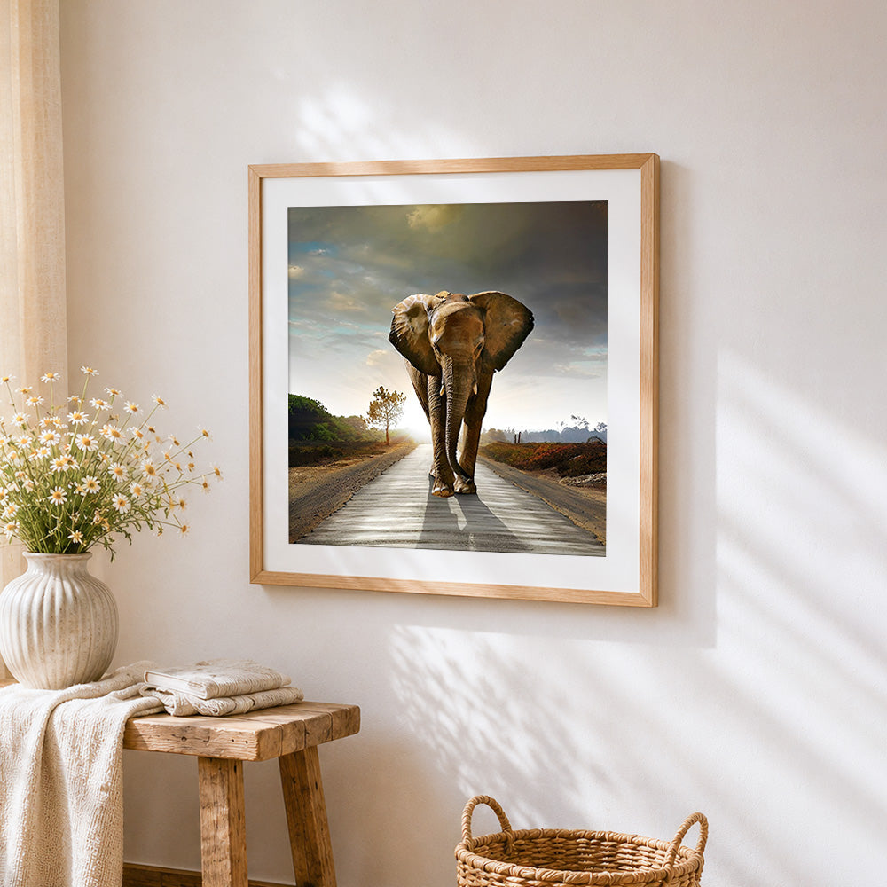 Elephant walking on a road cross stitch artwork displayed on wall as home decor