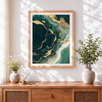 Finished emerald green and gold fluid art cross stitch artwork displayed