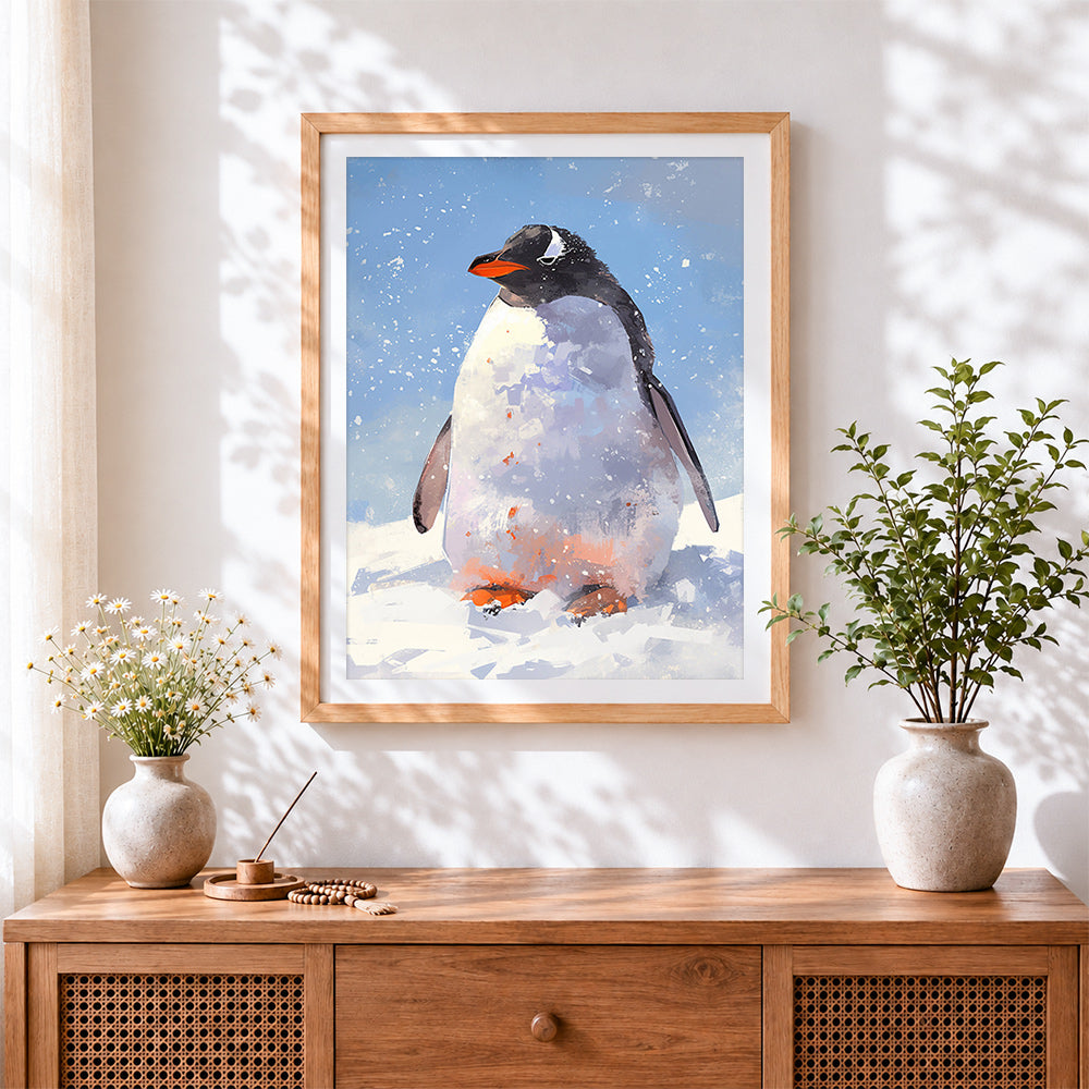 Finished emperor penguin in snowstorm cross stitch artwork displayed