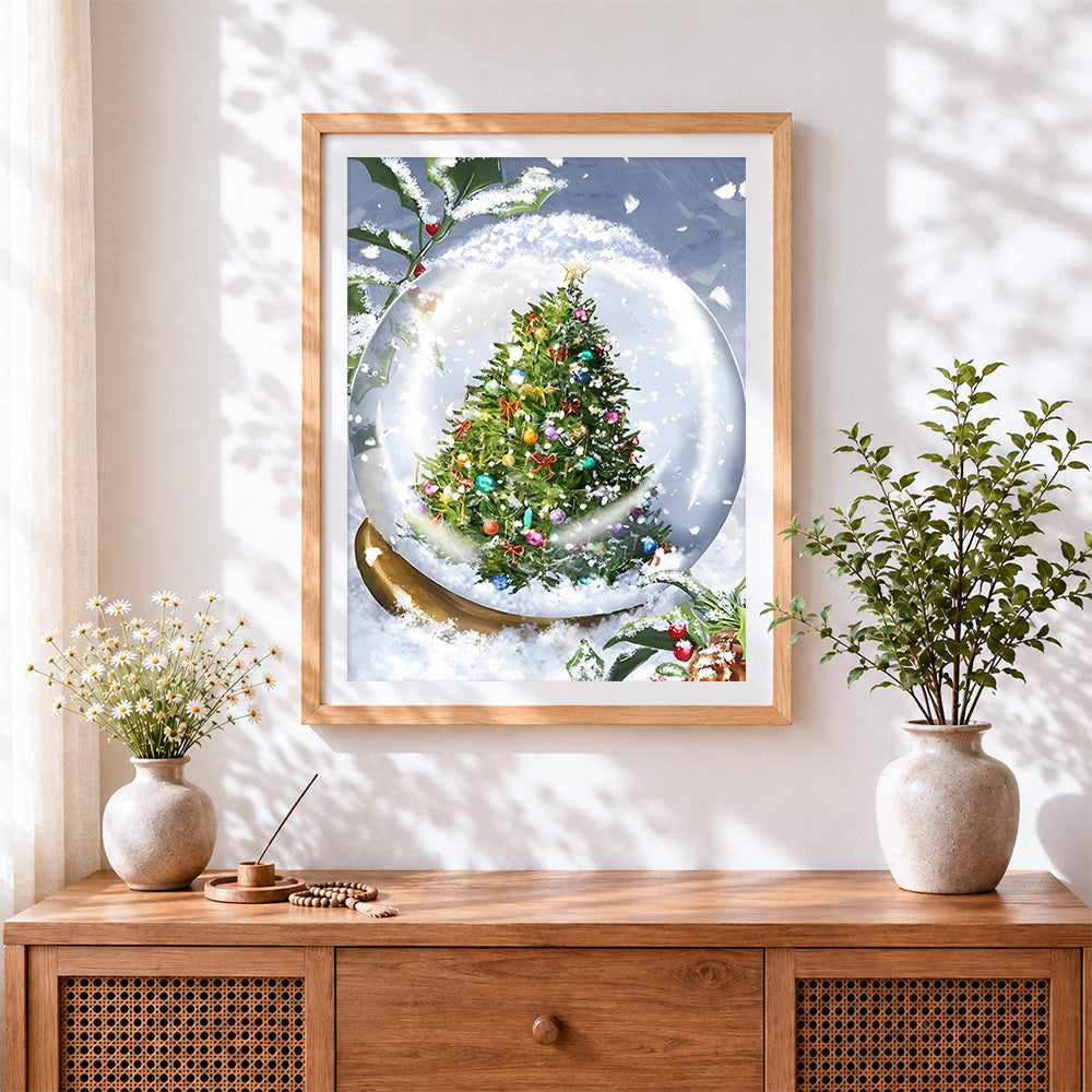 Finished enchanted christmas tree snow globe cross stitch artwork displayed