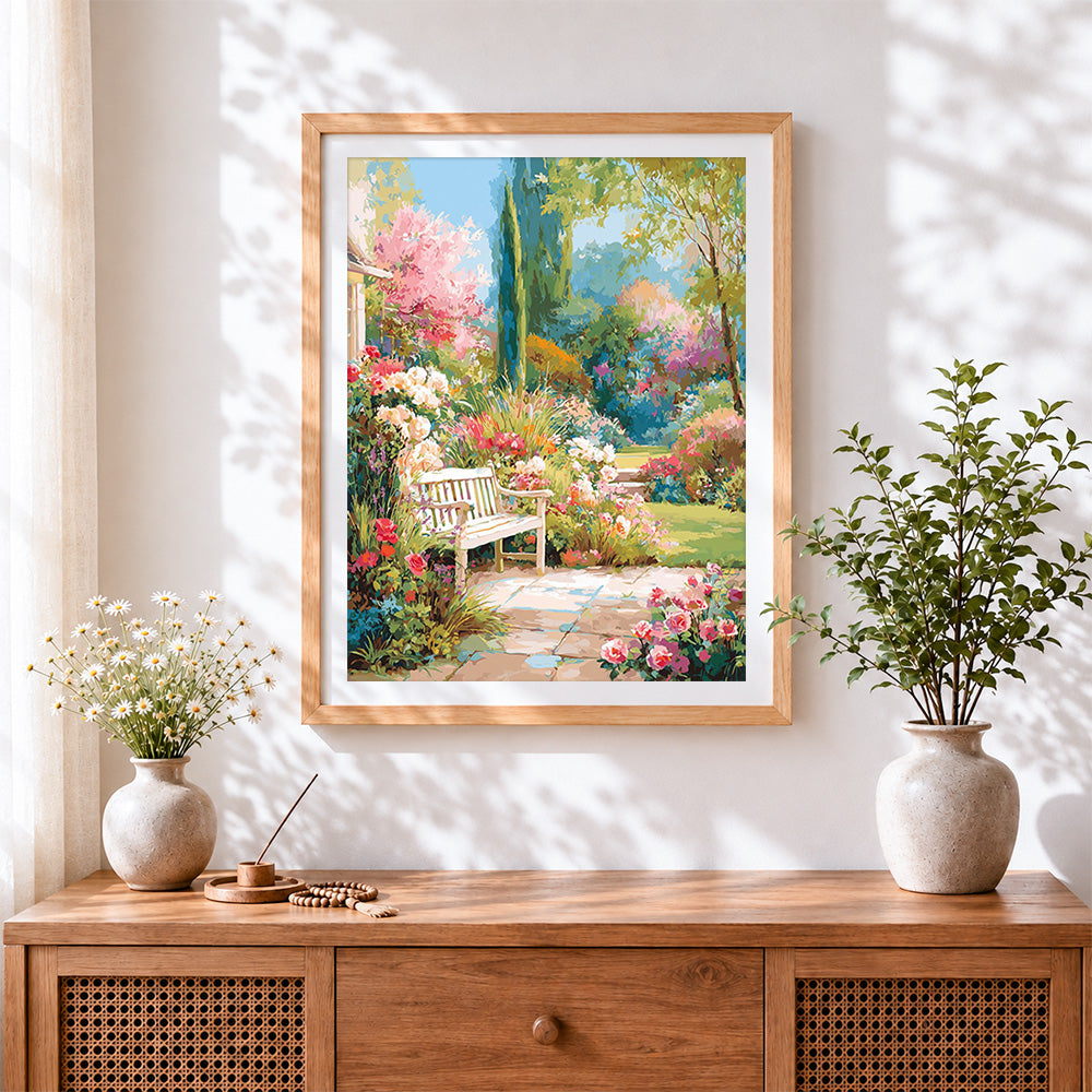 Finished english garden bench and blooming flowers cross stitch artwork displayed
