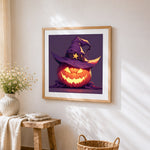 Evil pumpkin with a witch hat cross stitch artwork displayed on wall as home decor
