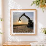 Finished excavator silhouette at sunset cross stitch artwork displayed
