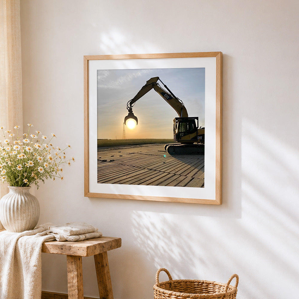 Excavator silhouette at sunset cross stitch artwork displayed on wall as home decor