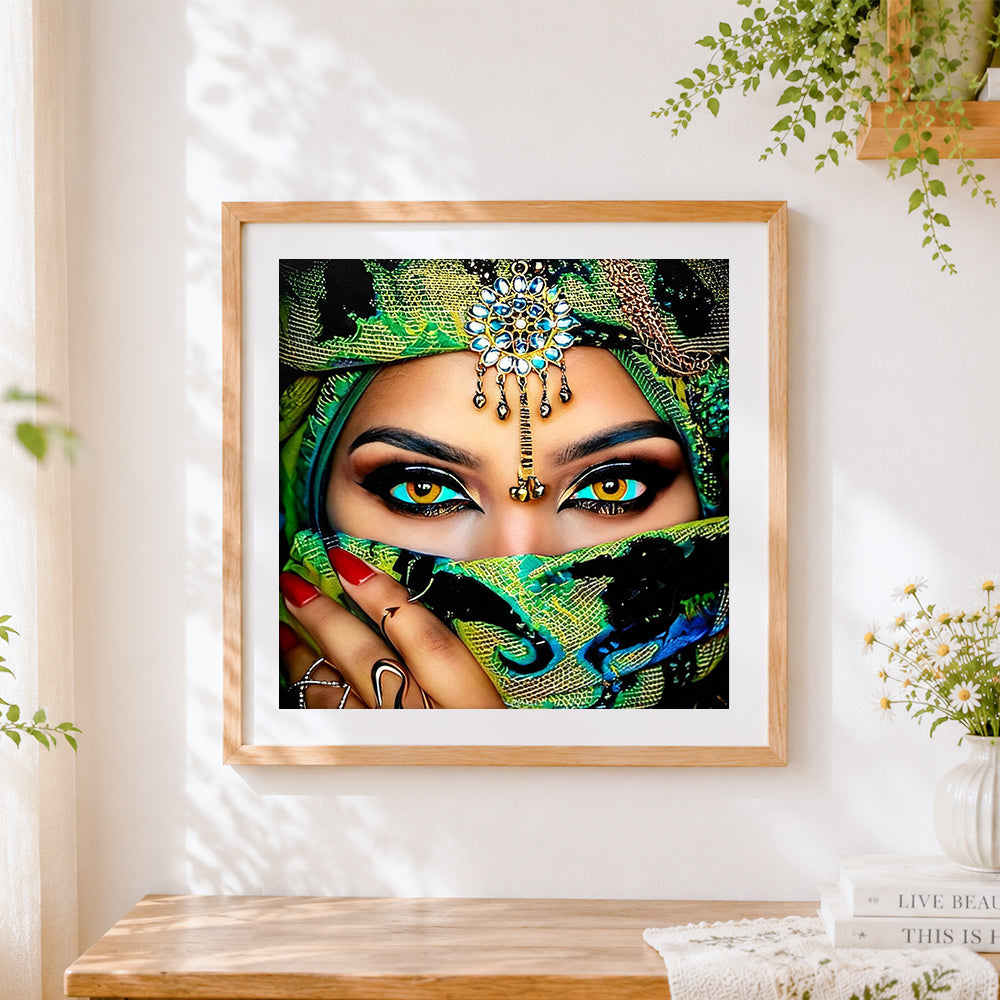 Finished exotic woman with green veil cross stitch artwork displayed