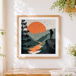 Finished explorer with binoculars on a cliff cross stitch artwork displayed