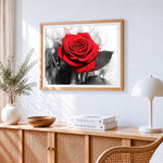 Eye catching red rose cross stitch artwork displayed on wall as home decor