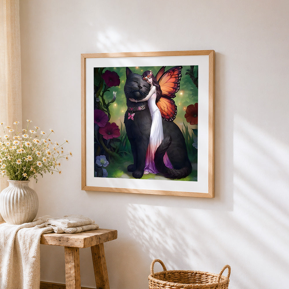 Fairy and giant black cat cross stitch artwork displayed on wall as home decor