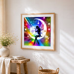 Fairy silhouette on rainbow moon cross stitch artwork displayed on wall as home decor