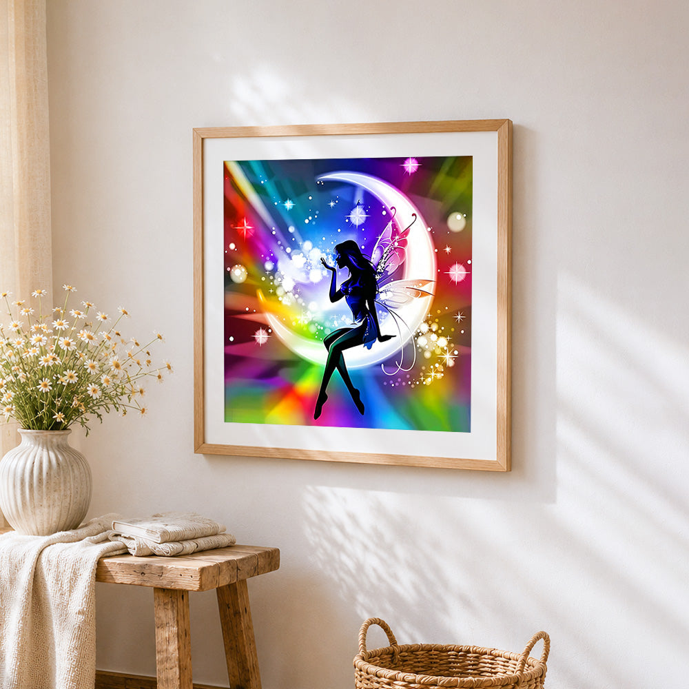 Fairy silhouette on rainbow moon cross stitch artwork displayed on wall as home decor