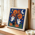 Fall tree ghosts punch needle artwork displayed on a table