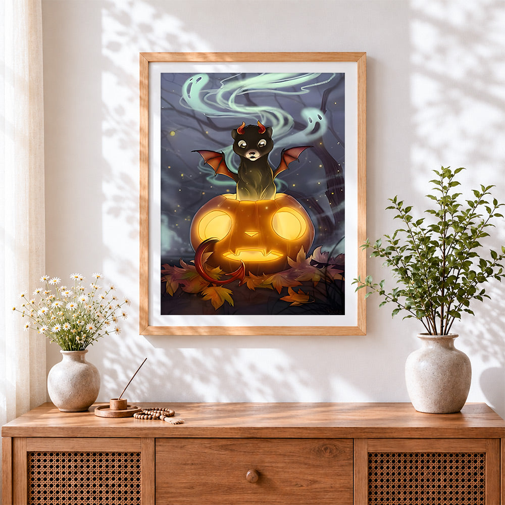Finished fantasy creature on glowing pumpkin cross stitch artwork displayed