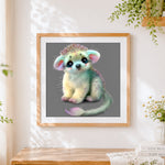Finished fantasy fluffy creature cross stitch artwork displayed