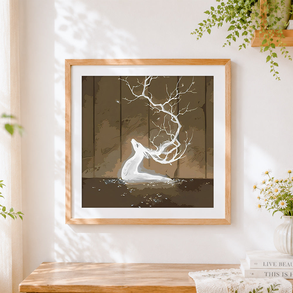 Finished fantasy white stag with tree antlers cross stitch artwork displayed