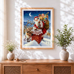 Finished father christmas and reindeer on a snowy chimney cross stitch artwork displayed