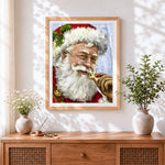 Finished father christmas eating a star cookie cross stitch artwork displayed
