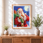 Finished father christmas going "shh!" cross stitch artwork displayed