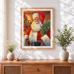 Finished father christmas holding a christmas wreath cross stitch artwork displayed