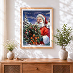 Finished father christmas holding a festive wreath cross stitch artwork displayed